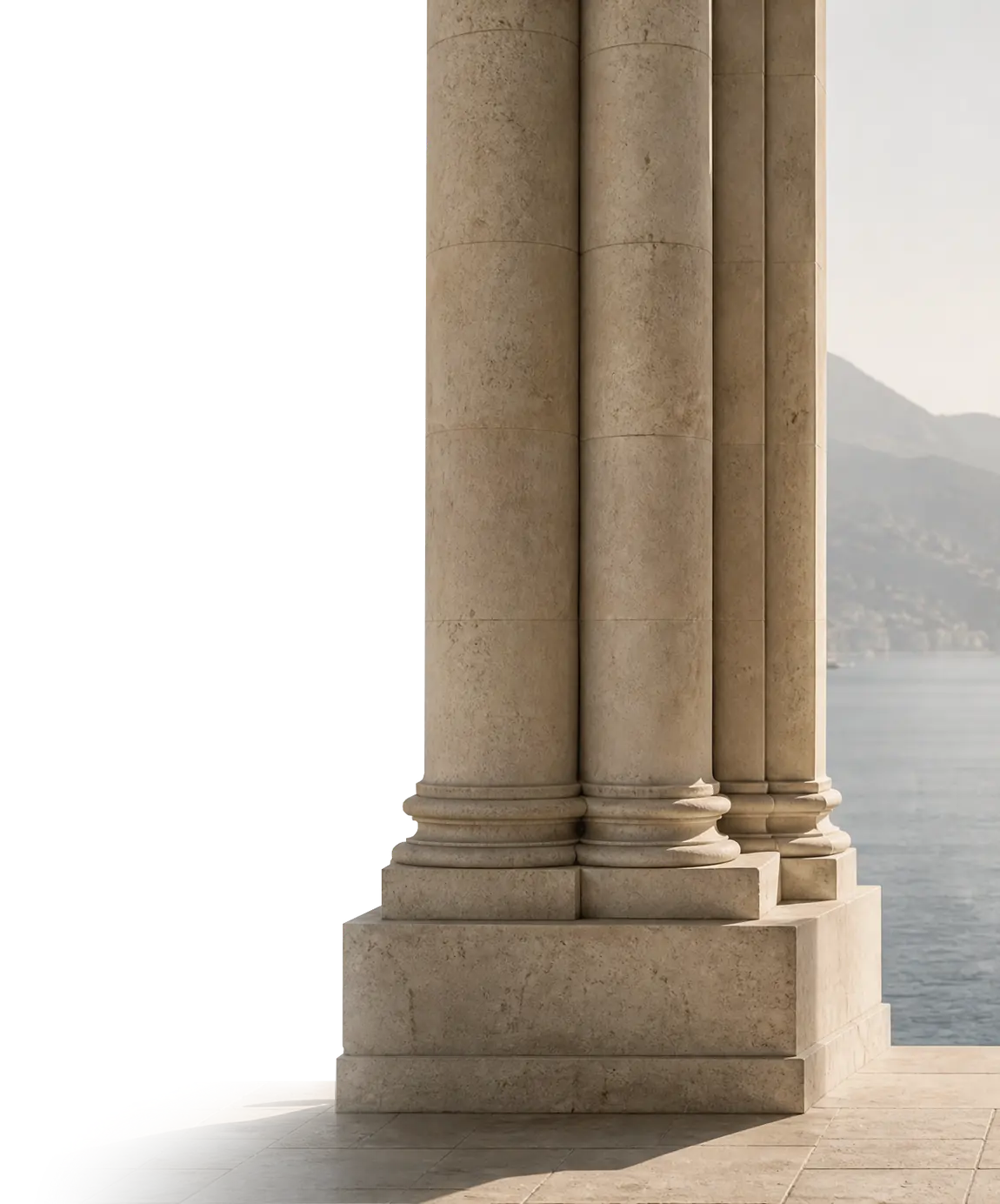 A stone colonnade opening onto a calm sea